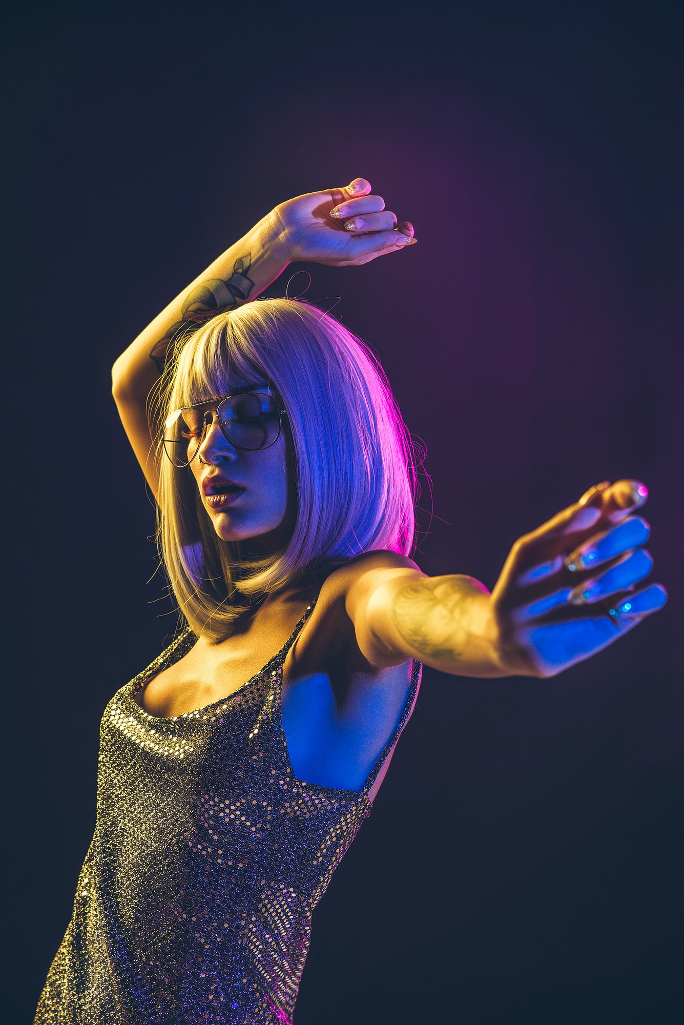 young woman with grey hair dancing and celebrate.jpg