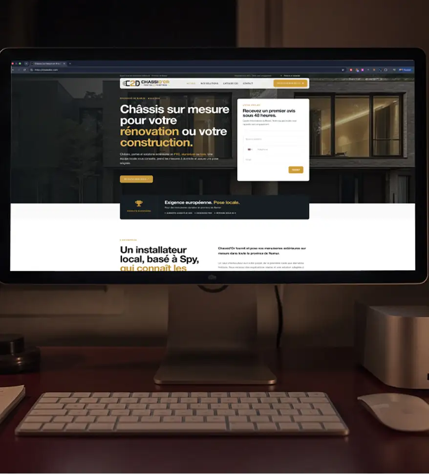 Châssis d'Or website displayed on a desktop monitor, showing the homepage design for custom windows and renovation services